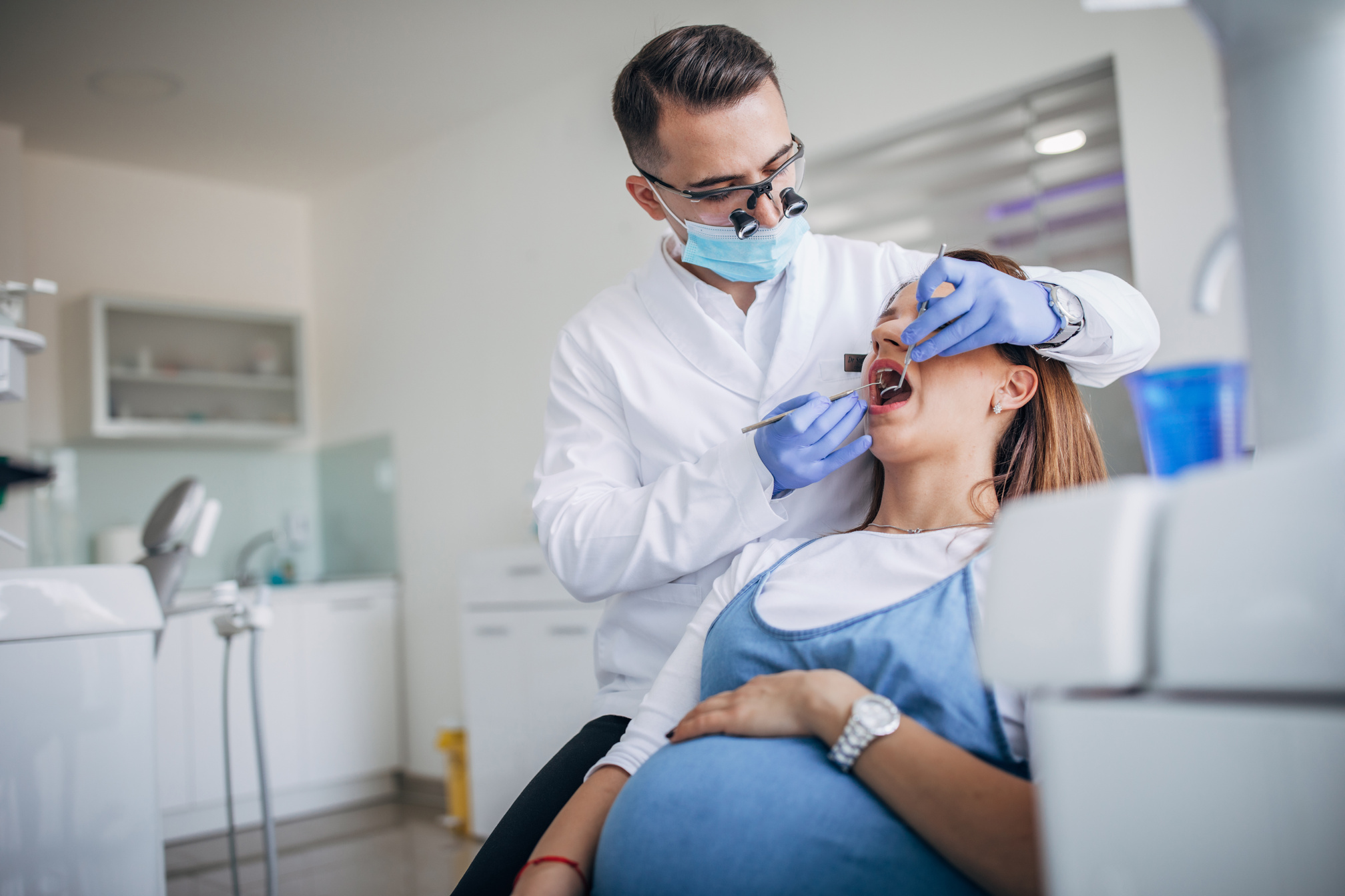 Dentist Examining the Teeth of a Pregnant Woman